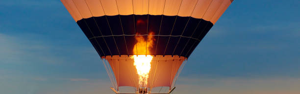 istock hot air balloon as it is inflated for flight, burning burner 860585456