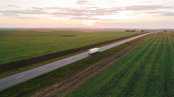 Aerial view of cargo trucks on the road in countryside in Ukraine
