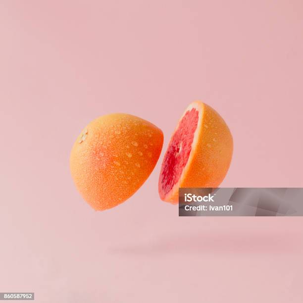 Grapefruit Sliced On Pastel Pink Background Minimal Fruit Concept Stock Photo - Download Image Now