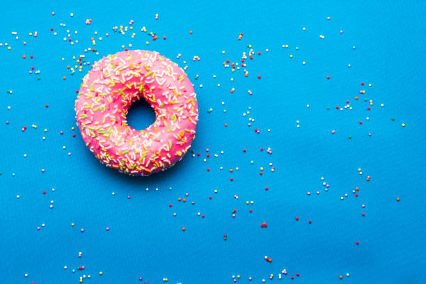 istock The donut in the glaze on a blue background 860590658