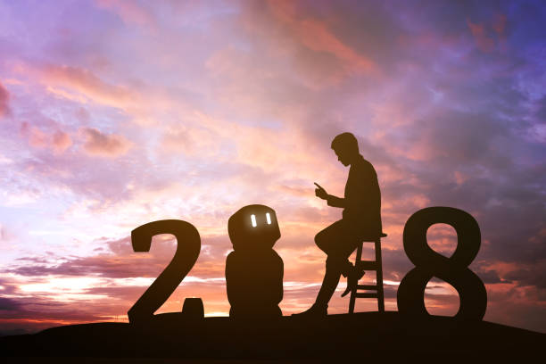 istock 2018 years of robot assistant technology , industry 4.0 , artificial intelligence trend concept. Silhouette of business man talking to automation robo advisor. Vivid twilight sunset sky background. 860591240