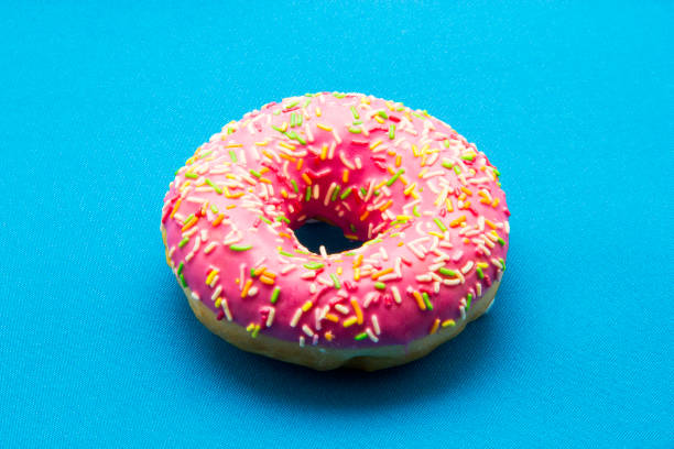istock The donut in the glaze on a blue background 860594060