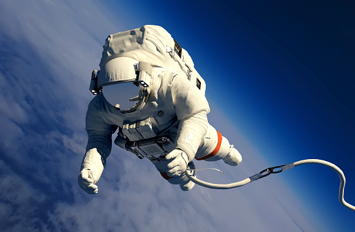 Astronaut in space above the clouds of the Earth.3d render