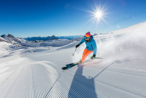 istock Young man skier running down the slope in Alpine mountains 860594924