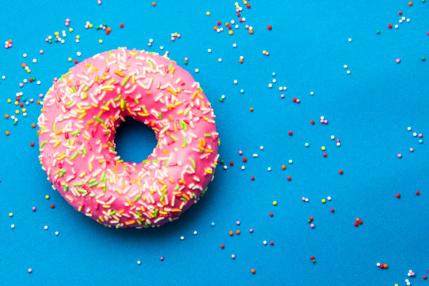 istock The donut in the glaze on a blue background 860595064