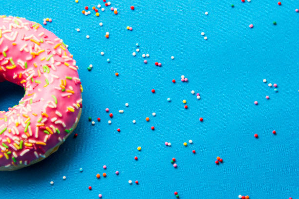 istock The donut in the glaze on a blue background 860595482