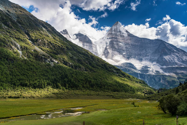 istock Snowy mountain and trees in rural landscape 860597646