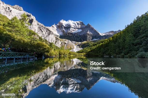 Snowy Mountain And Trees In Rural Landscape Stock Photo - Download Image Now - Beauty In Nature, Canyon, China - East Asia