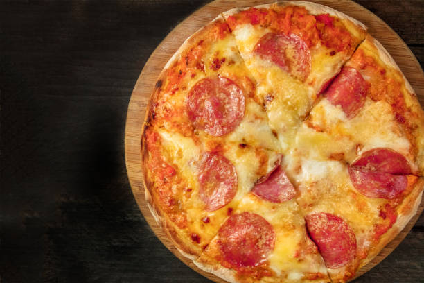 istock Cut pepperoni pizza with a place for text 860602816