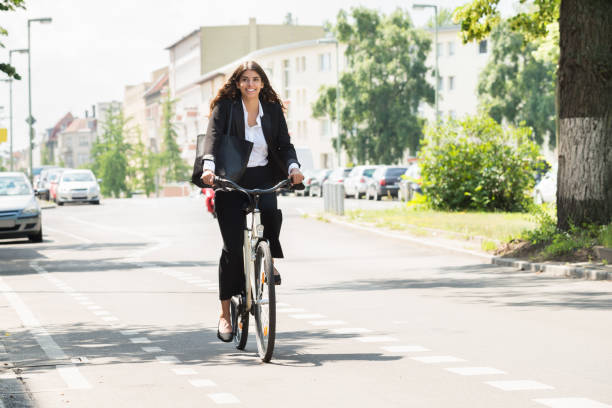 istock Businesswoman Riding Bicycle 860605298