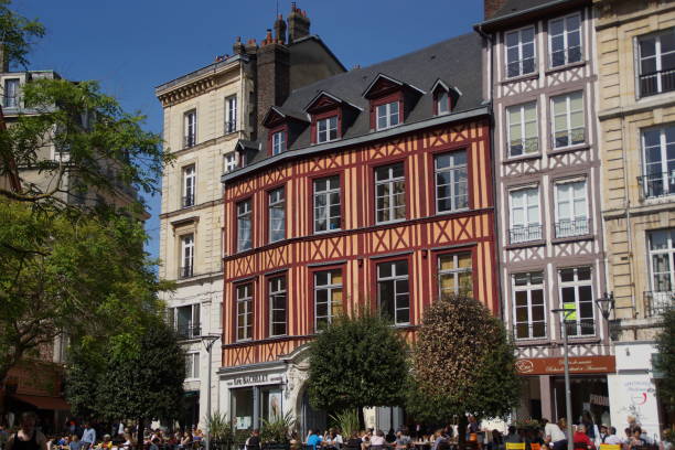 NORMANDY - REGION OF FRANCE The city of Rouen and its cathedral. Rouen is a commune in the Seine-Maritime department in north-western France. Notre-Dame Cathedral, officially the primatial cathedral of Notre-Dame de l'Assomption in Rouen, is the most prestigious monument in the city of Rouen. rue du gros horloge photos stock pictures, royalty-free photos & images