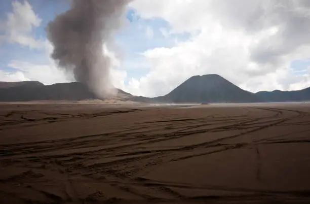 Brown sandy foot of the active Volcano mount Bromo early in the morning at the Tengger Semeru National Park in East Java, Indonesia.