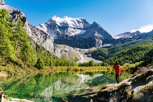 Couple men and women at Geisler Alm, Dolomites Italy, hiking in the mountains of Val Di Funes in Italian Dolomites Adolf Munkel Trail, Nature Park Geisler-Puez with Geisler Alm Puez Odle Nature Park