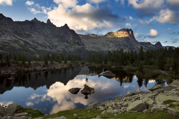 istock Mountain lake with island in the middle. 860618114