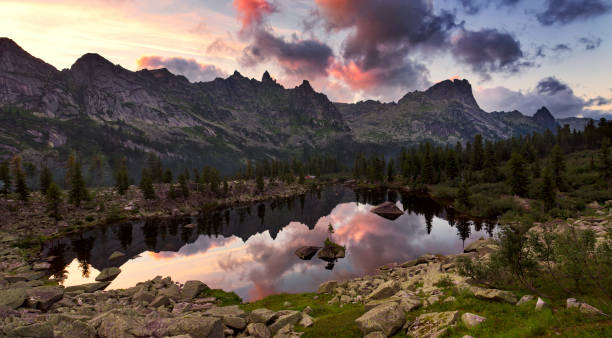 istock Mountain lake with island in the middle. 860618186