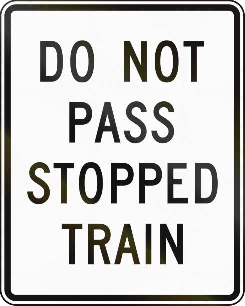 istock United States MUTCD road sign - Do not pass stopped train 860618524