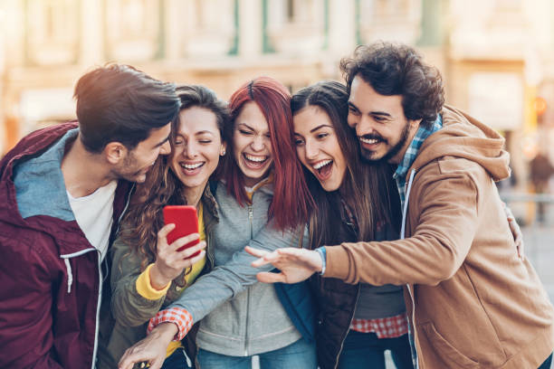 istock Group of friends watching and laughing 860624340
