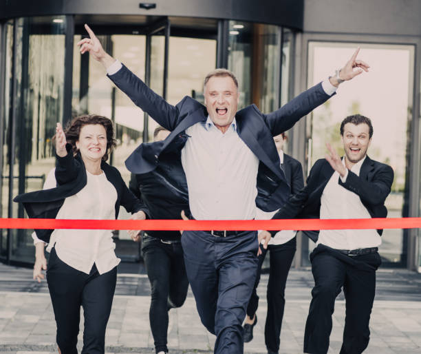 istock Business people crossing the finish line 860624840
