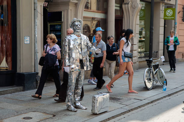 Krakow, Poland - August 14, 2017: Street performer - mirror man in the street of old town of Krakow.