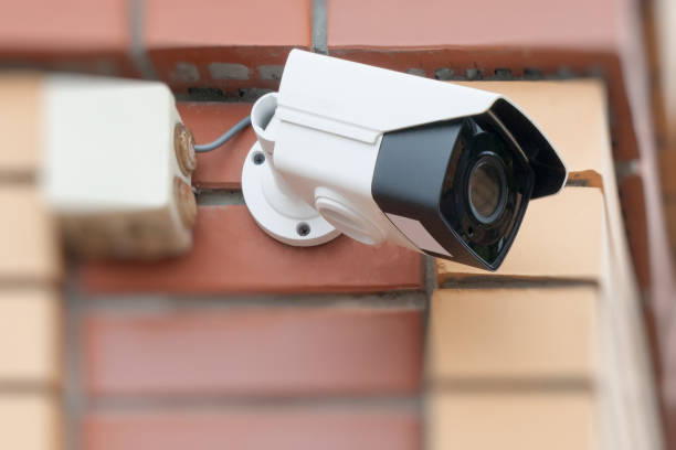 istock The surveillance camera on a house wall. 860635620