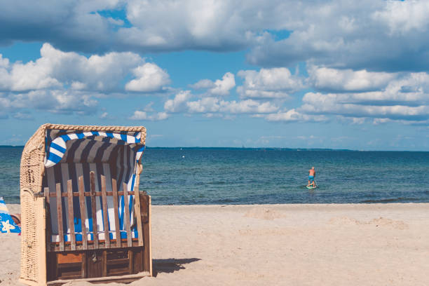 Stripe blue colourfed beach roofed chairs in Travemunde, Germany