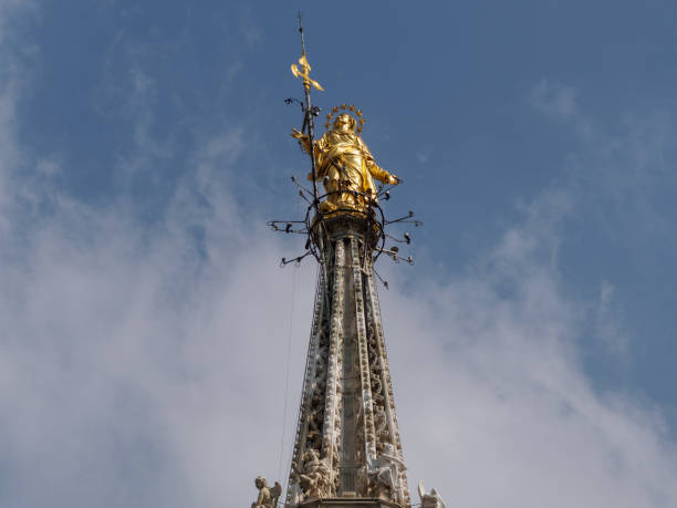 istock Golden madonnina statue outside Milan Cathedral 860638698