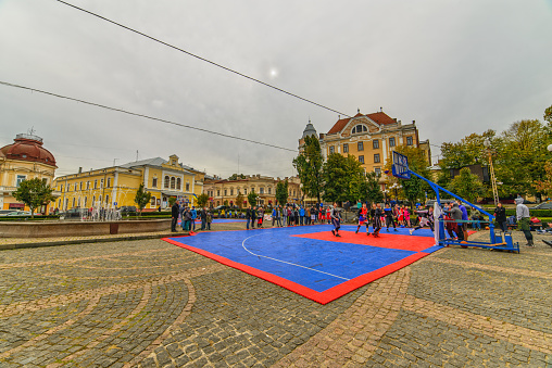 Chernivtsi, Ukraine - October 7, 2017: Street competitions in basketball. Fountain Square Philharmonic. Architecture in the old town Chernivtsi. Western Ukraine. Day of the city.