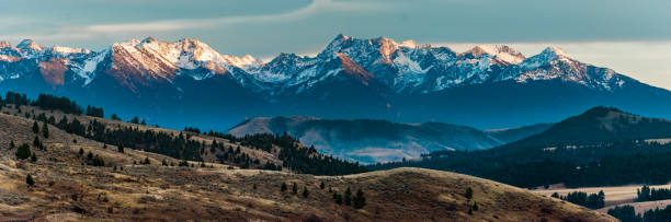 Alps Glow Sunset light just barely hitting the tops of the mountains. montana western usa photos stock pictures, royalty-free photos & images