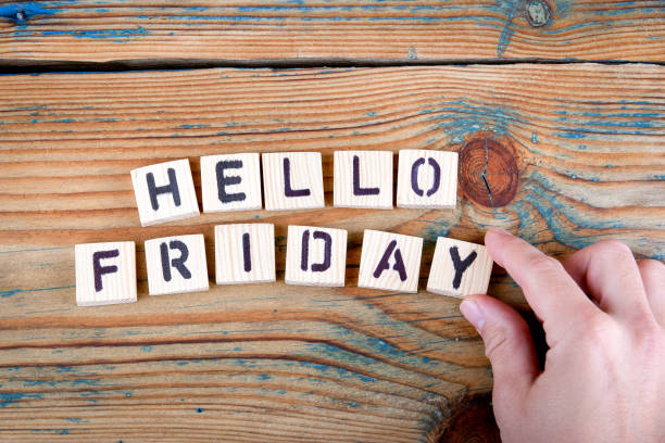 istock hello friday. Wooden letters on the office desk 860649198