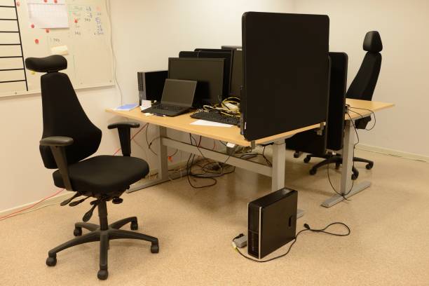istock Office Desks And Chairs in a row 860649354
