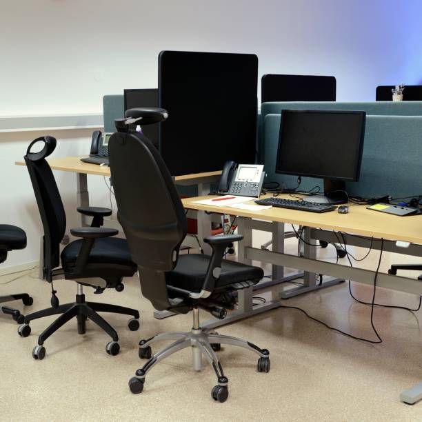 istock Office Desks And Chairs in a row. 860649372