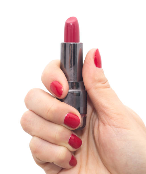 istock red lipstick in hand with red nail polish on a white background 860649550