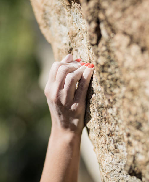 istock Female rock climber hand 860649824