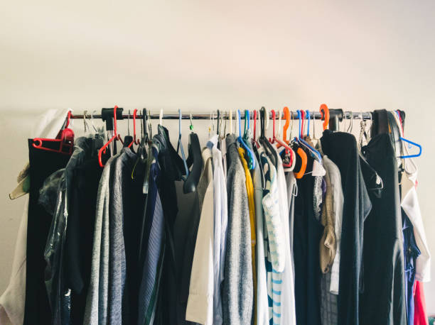 istock The open storage - wardrobe hanger with clothes in the room 860649880
