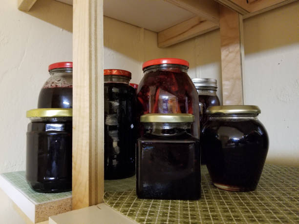 istock Jars with homemade jam preserves on the storage shelf 860650296