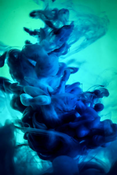 istock Acrylic colors and ink in water. Abstract frame background. Isolated on white 860650746