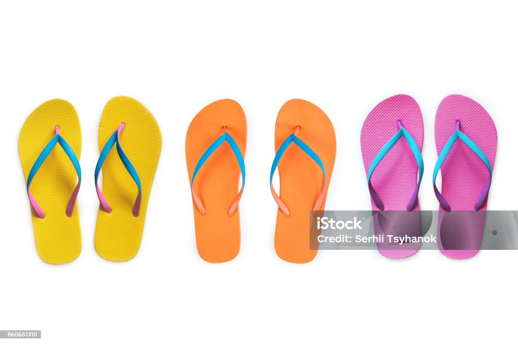 Yellow Orange Pink flip flops isolated on white background. Top view Flip-Flop Stock Photo