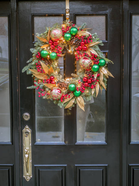 istock Christmas wreath on building door 860670476