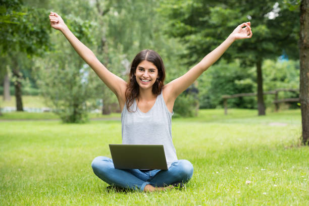 istock Excited Young Woman With Laptop 860682974
