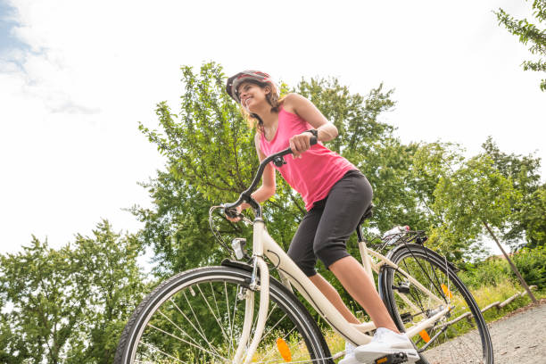 istock Happy Female Cyclist Riding Bicycle 860685836
