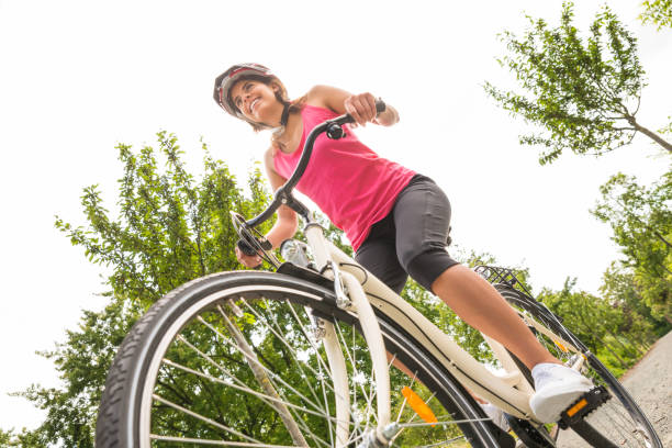 istock Happy Female Cyclist Riding Bicycle 860685912