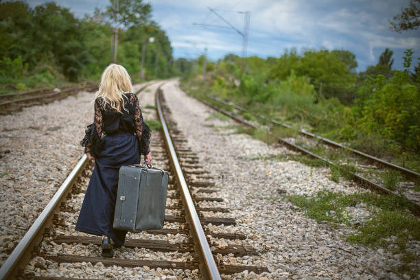 istock Woman on a railroad 860688848