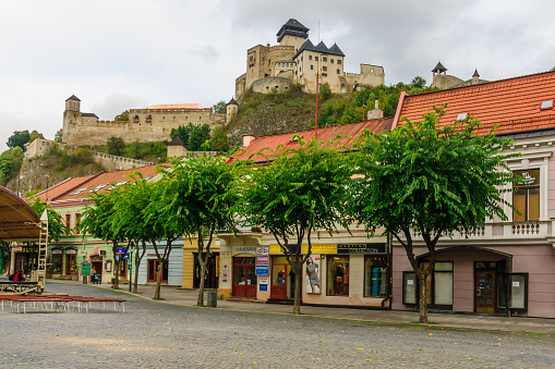 Trencin: View of the old center and the castle, with locals and visitors, in Trencin, Slovakia