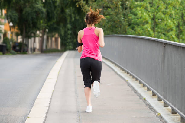 istock Fitness Woman Running On Sidewalk 860689054