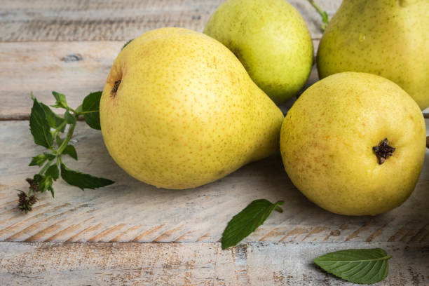 istock Fresh organic pears on old wood. Fruit background. Pear autumn harvest 860696776