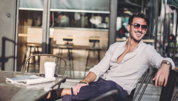 istock Man relaxing in coffee shop 860700510
