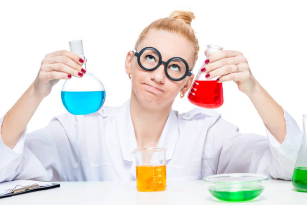 istock Beautiful crazy biologist chemist with test tubes thinks about the experience 860701582