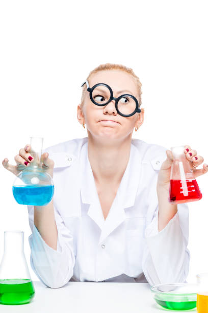 istock tired crazy chemist in glasses with test tubes conducting experiments in the laboratory 860701586