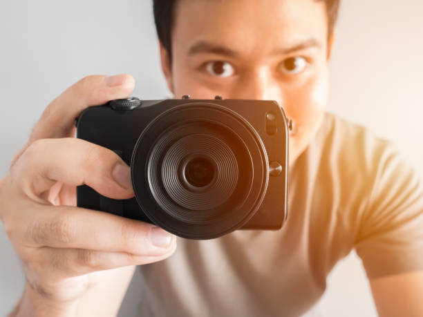 istock Man taking photo of you with mirrorless camera. 860701702