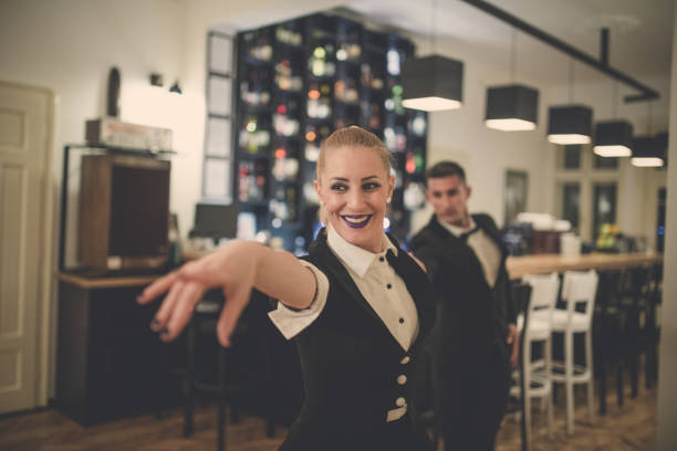 istock Young couple dancing in cafe 860704274